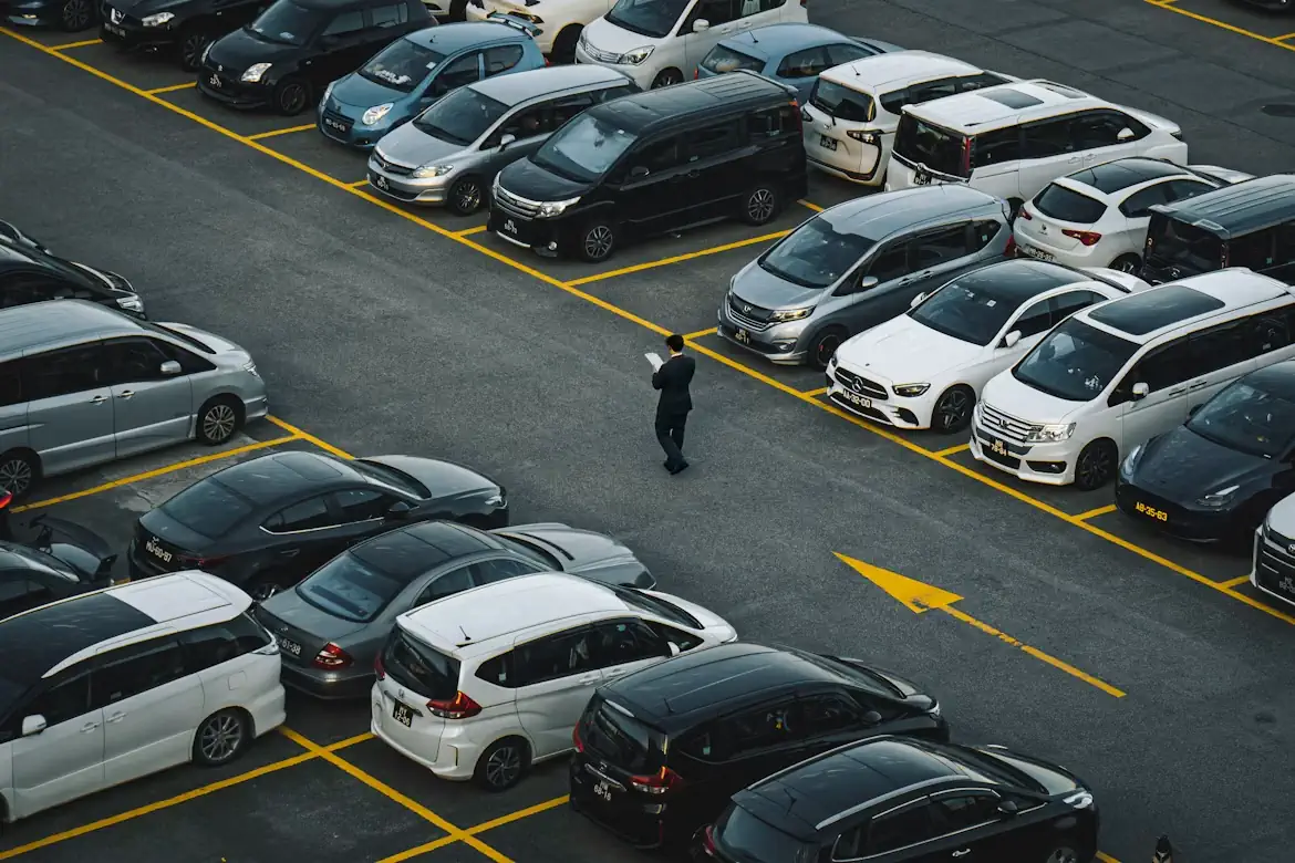 Aerial view of a car park full of different car makes and body types